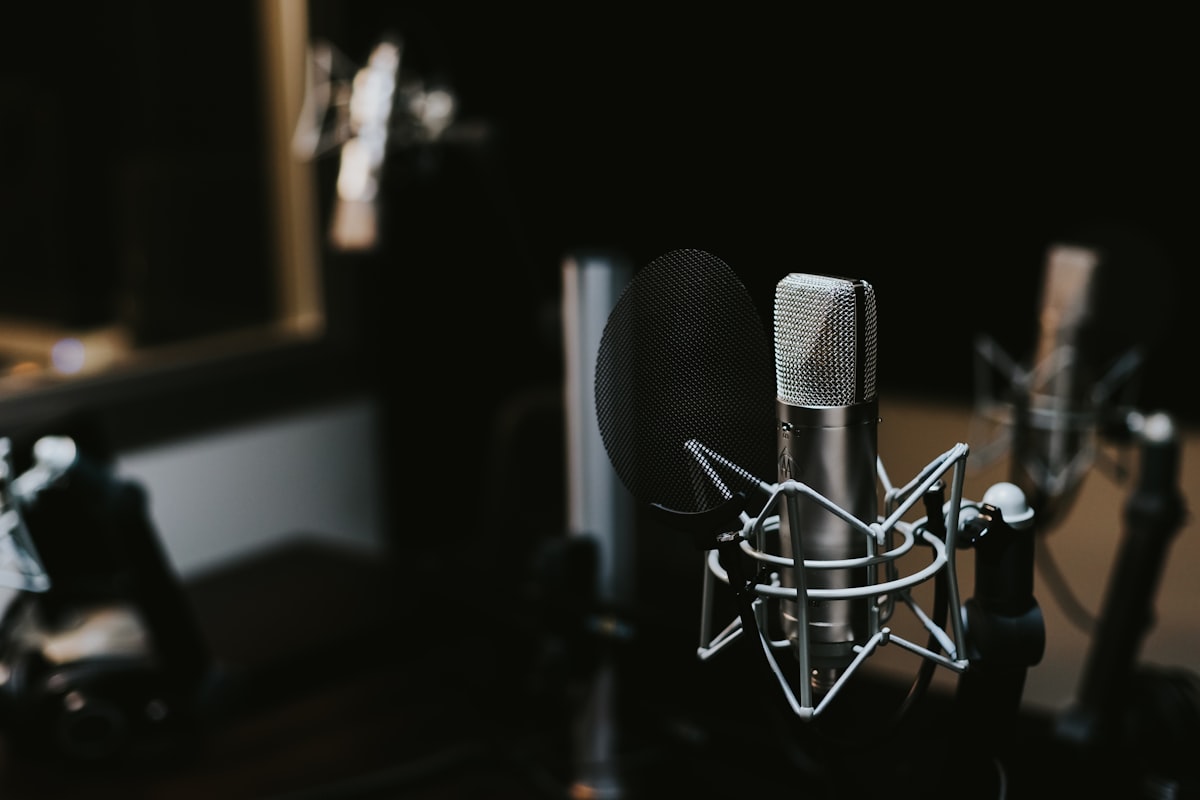 A studio microphone on a desk, representing free AI voice and audio tools.